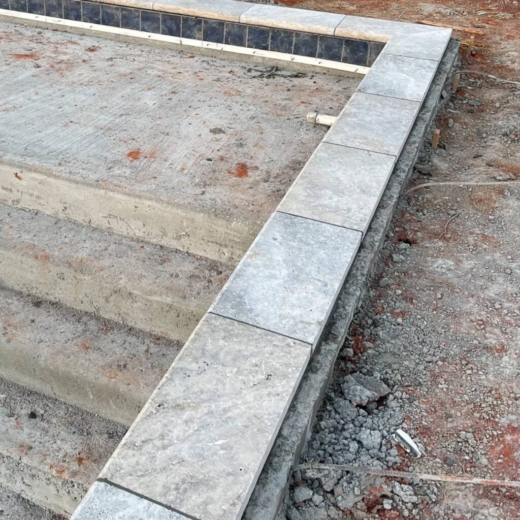 concrete steps in a pool that is under construction